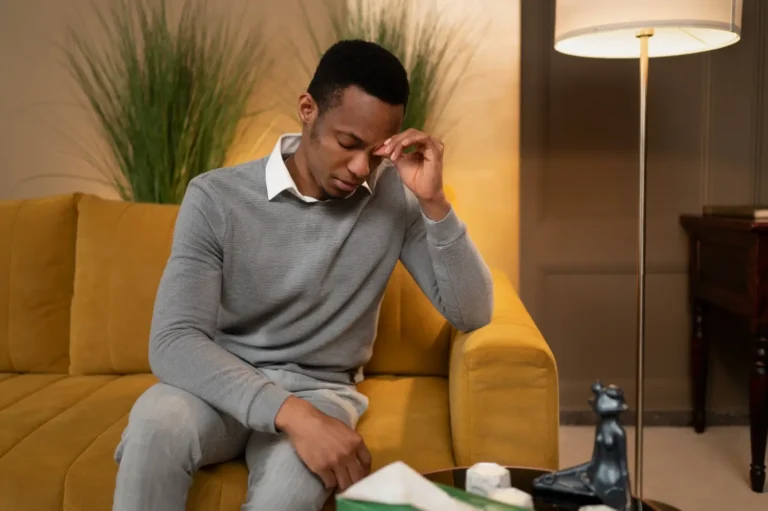 a man sitting on a couch-Men's Health Coaching & Fitness Training