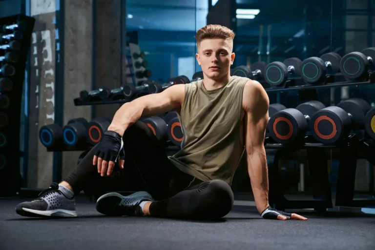 a man sitting on the floor-Men's Health Coaching & Fitness Training