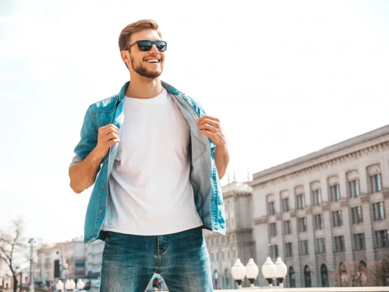 Confident smiling man in casual denim outfit symbolizing emotional intelligence, self-worth, and men's personal -Men's Health Coaching & Fitness Traininggrowth.